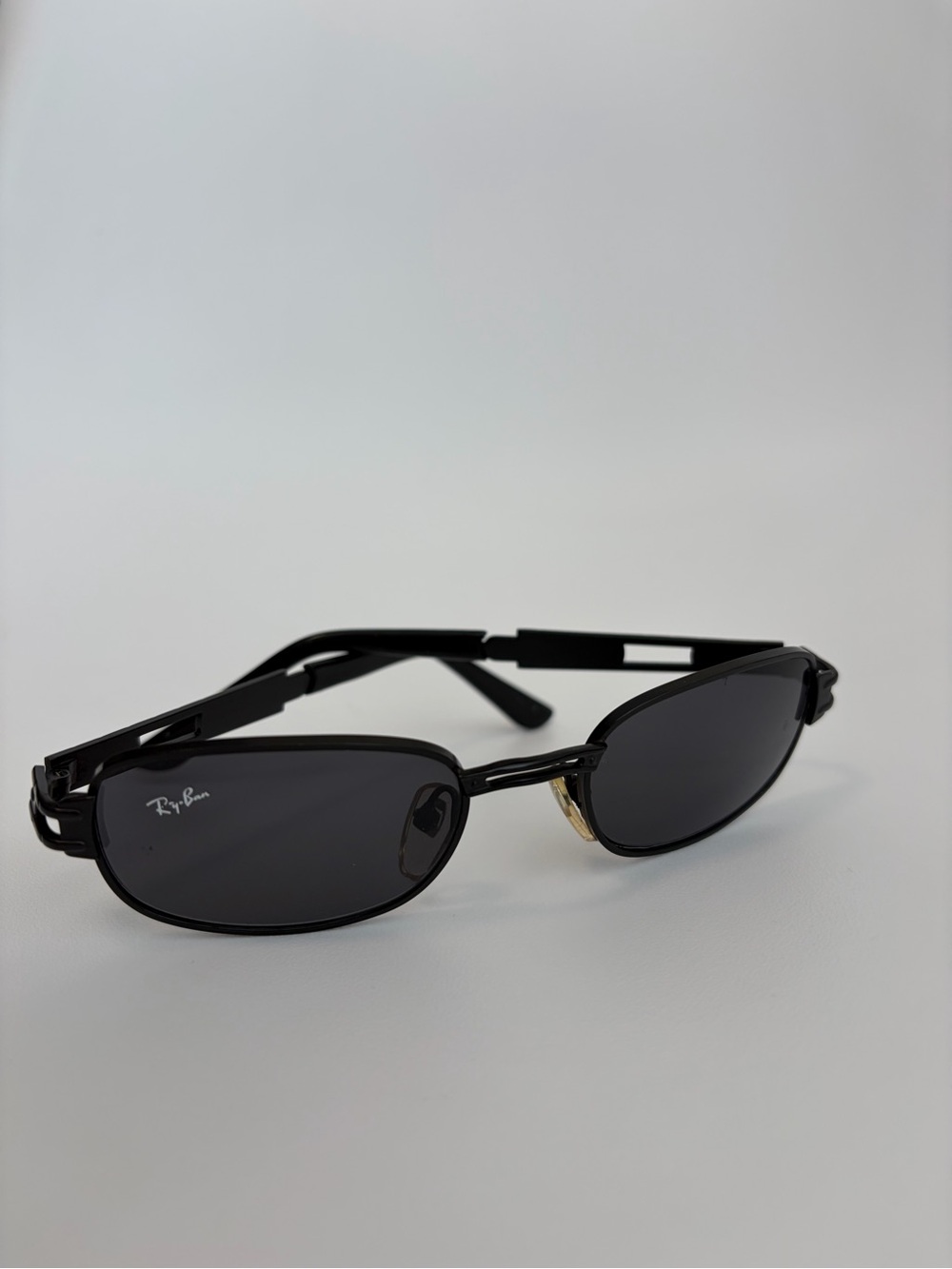 Ray-Ban Vintage 1990s Black Oval Metal Sunglasses with Dark Lenses